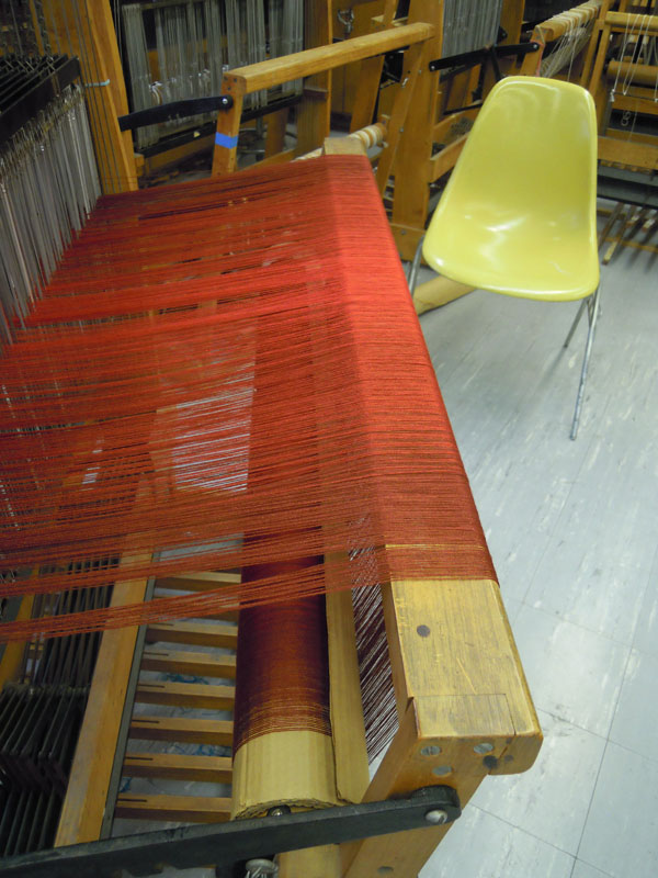 This is warp as it rises up over the back beam of the loom.The threads remain parallel.