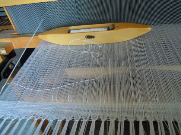 An couple inches woven on loom.