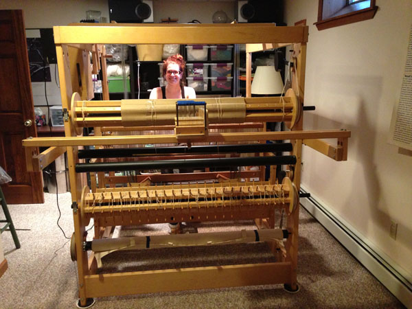 Me sitting at the new loom in it's temporary home.