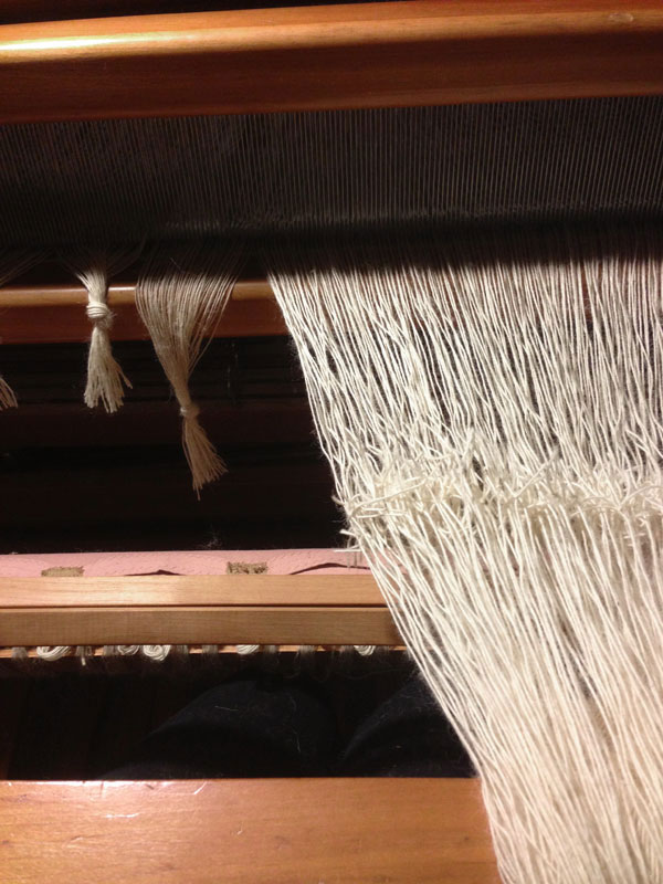 About 215 ends in the tying of a new warp to the old warp. Practice makes perfect!