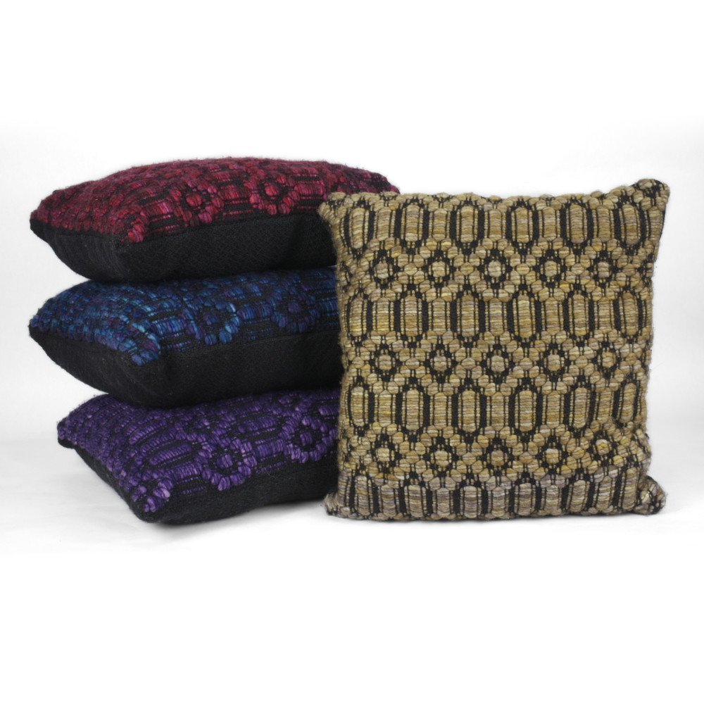 Pile of three pillows behind a standing pillow to show thickness and back side color.